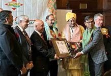 Dr. Sundeep Jain Honored with Bharat Gaurav Award at British Parliament in London Dr.Sundeep Jain receiving the award in London