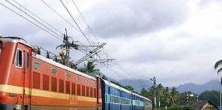 High-tech surveillance cameras being installed on railway track poles for improved security and monitoring