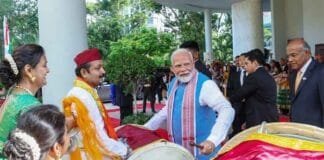 PM Modi Plays Drums and Receives Rakhi During Enthusiastic Singapore Welcome PM Modi plays drums Singapore