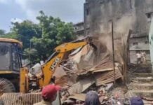 Bulldozer Action in Surat: Illegal Structures Demolished Following Ganesh Pandal Attack Surat bulldozer action - Surat demolition news