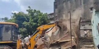 Bulldozer Action in Surat: Illegal Structures Demolished Following Ganesh Pandal Attack Surat bulldozer action - Surat demolition news