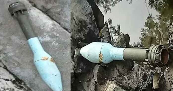 Police-and-bomb-squad-perso Police and bomb squad personnel investigate a rocket launcher found near the Andanallur temple in Trichy district, Tamil Nadu, as locals watch in concern