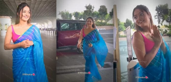 Viral-Video-of-Monalisa-in- Monalisa stuns in a blue saree at Mumbai Airport – fans can’t stop talking about her look!