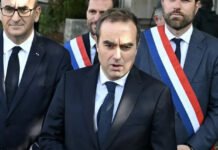 France Political Crisis Averted: Macron’s Government Survives Two No-Confidence Votes President Emmanuel Macron addressing press 2025 political crisis