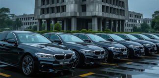 Lokpal Under Fire for Tender to Buy Seven BMW Cars Worth Over ₹4 Crore Seven BMW cars parked in front of a government office as part of Lokpal tender controversy.