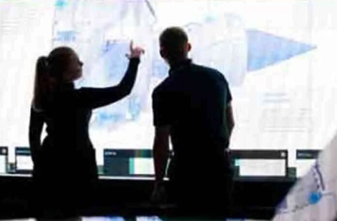 Brussels skyline with EU flag; economic forecast predicts export surge amid U.S. tariff concerns.