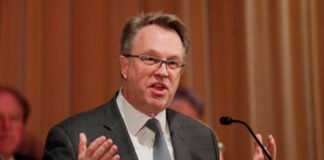 Markets Jump as Fed’s John Williams Signals Possible Near-Term Rate Cut New York Fed President John Williams speaking at an economic policy event.