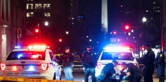 Afghan SIV suspect, Washington DC shooting, National Guard attack, Rahmanullah Lakanwal arrest, FBI investigation, immigration security debate, ISIS propaganda found Police and federal agents securing the scene of a shooting near a National Guard recruiting office in Washington, D.C.