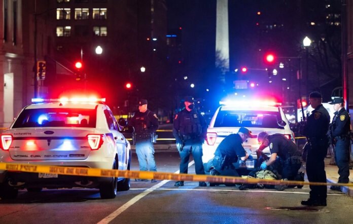 Police and federal agents securing the scene of a shooting near a National Guard recruiting office in Washington, D.C.
