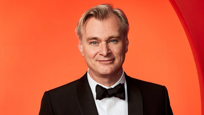 Christopher Nolan at Universal Studios announcing his next film Omega, a two-universe philosophical sci-fi thriller.