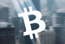 Bitcoin Slumps Sharply, Wiping Out 2025 Gains in Its Worst Monthly Drop Since 2022 Bitcoin coin graphic showing price decline during a major market downturn.