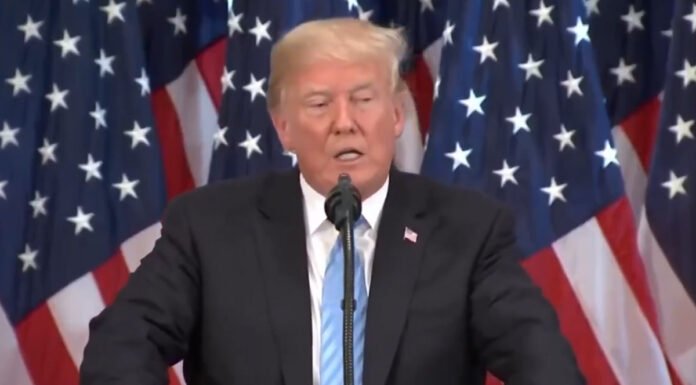 Trump Signs AI Executive Order President Trump signing an executive order on AI regulation in the White House.