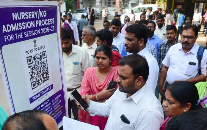 Parents filling Delhi nursery admission forms for 2026–27 session at private schools