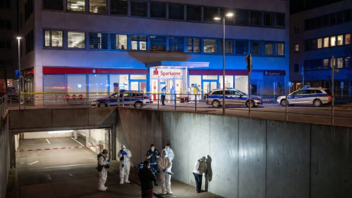German police outside Sparkasse bank after Hollywood-style vault heist