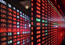 Global Markets Sink as Trump Tariff Threats Trigger Recession Jitters and Wipe Out $1 Trillion Global stock market screens showing sharp declines after Trump tariff threats.