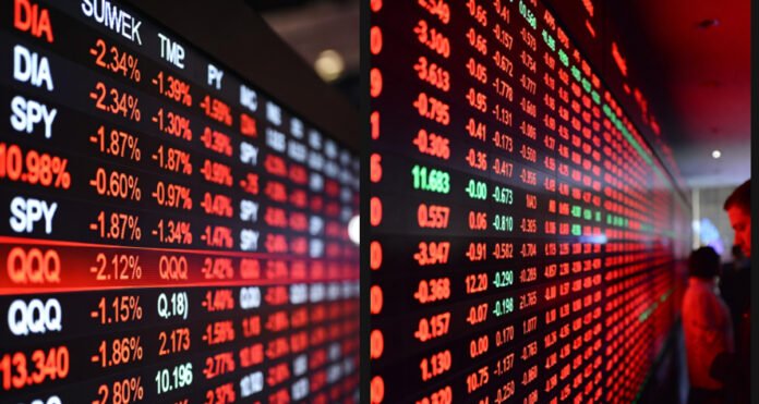 Global stock market screens showing sharp declines after Trump tariff threats.