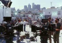 Hollywood 2025 in Retrospect: Production Drops, AI Disruption, and Corporate Shakeups Hollywood skyline with film production sets and cameras, highlighting industry trends in 2025