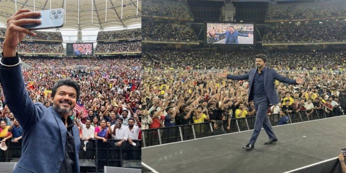 Thalapathy Vijay on stage at the Jana Nayagan audio launch in Malaysia with massive fan crowd