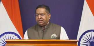 India Raises Concerns with US Over Mass H-1B Visa MEA spokesperson Randhir Jaiswal addressing press briefing on H-1B visa delays and overseas Indian citizens issues December 2025