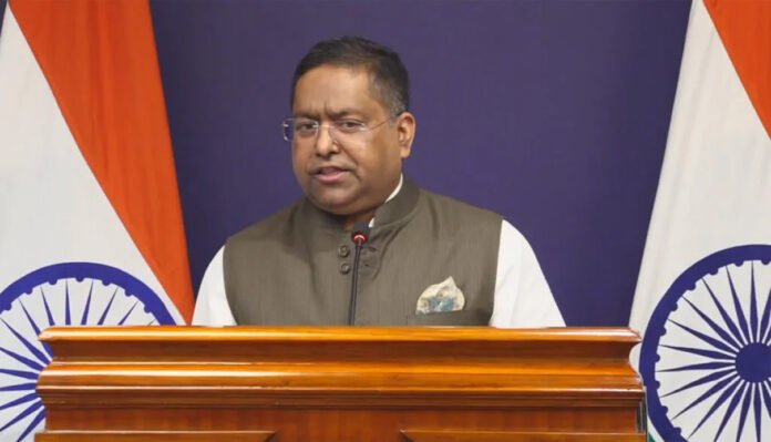 MEA spokesperson Randhir Jaiswal addressing press briefing on H-1B visa delays and overseas Indian citizens issues December 2025