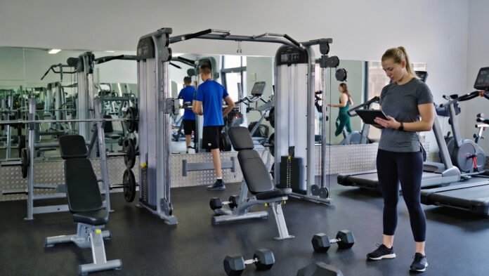 Wellness trends 2025 showing strength training, recovery workouts, and wearable health technology