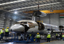 Adani Defence, Embraer Forge Historic Partnership to Establish Aircraft Manufacturing Hub in India Adani Defence and Embraer executives announcing aircraft manufacturing partnership in India