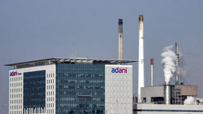 Adani Power corporate office with power plant infrastructure in the background