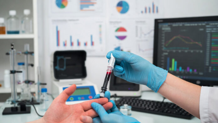 Finger-prick blood test being used for early Alzheimer’s biomarker detection in clinical research.