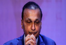 ED Attaches ₹1,885 Crore Assets of Anil Ambani’s Reliance ADAG in Money Laundering Probe Anil Ambani during corporate event with overlay text indicating ED asset attachment January 2026