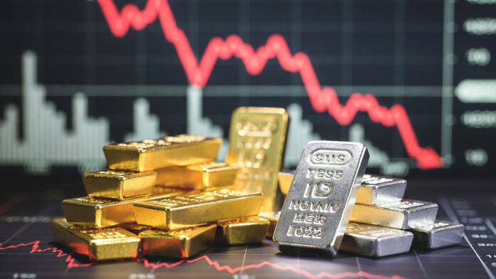 Gold and silver bars displayed with falling price chart amid market correction