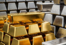 Gold Hits ₹1.83 Lakh per 10g, Silver Tops ₹4 Lakh per kg as Safe-Haven Demand Surges Gold and silver bars displayed at a bullion market in Delhi as prices hit record highs