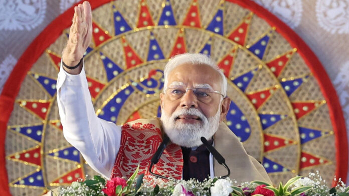 PM Narendra Modi addressing a public rally in Singur, West Bengal, highlighting new development projects.