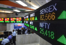 Sensex Rallies 222 Points to 82,566, Nifty Tops 25,400 on L&T Gains and Upbeat GDP Forecast BSE Sensex and Nifty indices showing green upward arrows on digital display board at Bombay Stock Exchange