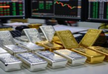 Silver Hits Record ₹2,59,692/kg, Then Slips as Profit-Taking Pressures Gold and Silver Prices Silver and gold bars displayed with MCX market charts showing price volatility