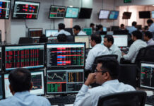 Market Opens on Edge Ahead of Budget: Defense, Banks, Green Energy in Focus Indian stock market screens showing volatility ahead of Union Budget