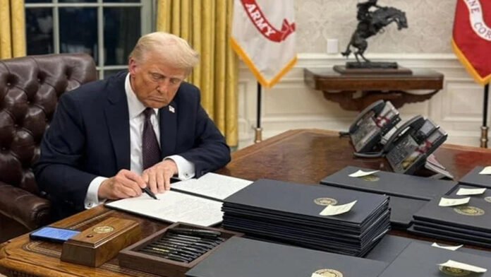 trump-latin-america-policy- US President Donald Trump speaking at a podium with flags behind him