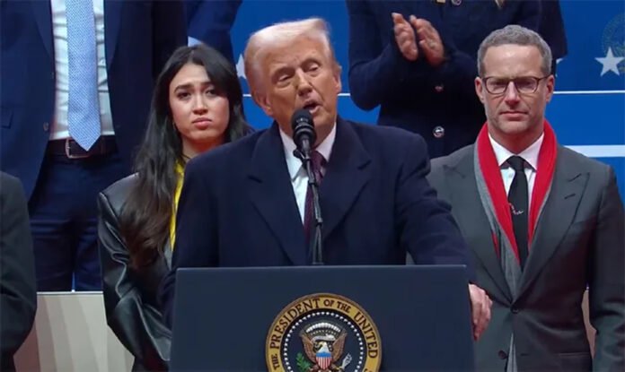 Donald Trump speaking at a podium while addressing US economic policy
