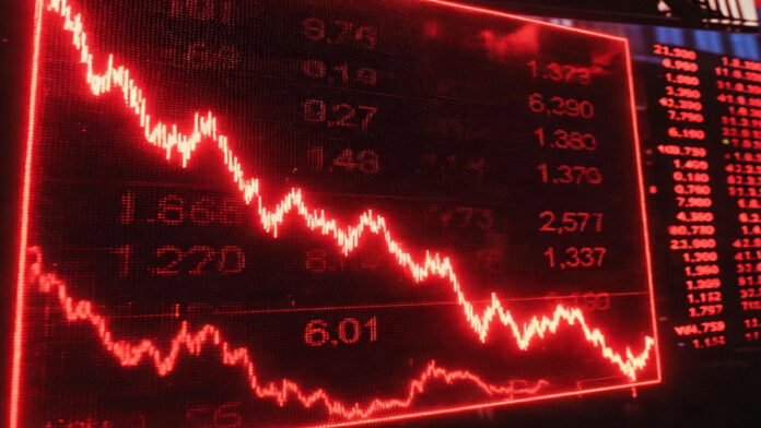 Wall Street screens showing market crash after Trump’s tariff warning