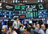 Wall Street Hits New Record Highs; Tech Stocks Drive Broad Rally as AI Momentum Strengthens Wall Street stock market trading floor and closing bell with rising index screens