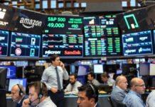 Wall Street Hits New Record Highs; Tech Stocks Drive Broad Rally as AI Momentum Strengthens Wall Street stock market trading floor and closing bell with rising index screens