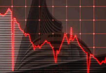 Sensex Plunges 558 Points as IT Stocks Crash on AI Disruption Fears Traders monitor red screens at Bombay Stock Exchange during Sensex 558-point decline on February 12, 2026