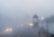 Delhi Fog Alert: IMD Issues Yellow Warning for Tuesday as February 2026 Turns Coldest Since 2022 Dense morning fog reduces visibility over Delhi roads and landmarks on a cold February day in 2026