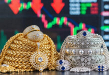 Silver Crashes ₹26,000, Gold Drops ₹6,000: Precious Metals See Sharp Correction Gold and silver bars with commodity trading screen showing sharp price drop in MCX and COMEX markets.