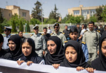 Anti-Government Protests Continue at Iranian Universities Amid Rising U.S. Tensions Students protesting at a university campus in Tehran amid heightened security