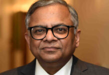 Tata Sons Board to Consider Third Term for N. Chandrasekaran; Leadership Extension Could Run Through 2032 N. Chandrasekaran speaking at a corporate event with Tata Sons headquarters in the background