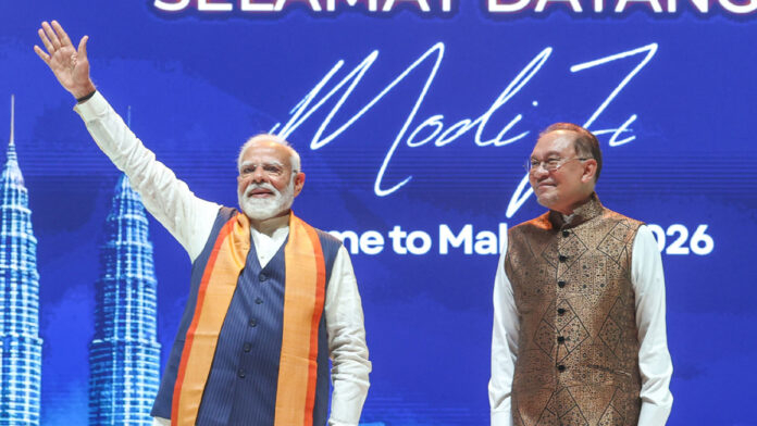 Prime Minister Narendra Modi receives a guard of honor in Putrajaya during his Malaysia visit