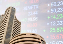Sensex Slips 27 Points, Nifty Inches Higher in Volatile Trade as Investors Stay Cautious Ahead of U.S.–Iran Talks Bombay Stock Exchange building in Mumbai with Sensex and Nifty trading data displayed