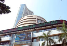 Indian Stock Market Opens Higher; Sensex Jumps 277 Points, Nifty Crosses 26,000 Mark Bombay Stock Exchange building with green stock market numbers showing Sensex and Nifty gains