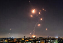 US and Israel Launch Joint Strikes on Iran; Tehran Fires Back With Ballistic Missiles Missile defense system intercepting incoming ballistic missiles over Tel Aviv following US-Israel strikes on Iran
