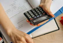 How to calculate interest for your personal loan using a compound interest calculator Person using compound interest calculator on laptop to calculate personal loan EMI and interest
